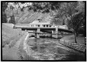 August, 1971. TAILRACE and 1917 BUILDING IN BACKGROUND SHOWING PENSTOCK INTAKE TO PLANT. - Telluride Power Company, Olmsted Hydroelectric Plant, mouth of Provo River Canyon HAER UTAH,25-OREM.V,2-6