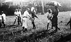 NZ sailors removing white band, insignia of the Mau, from lavalava 1930