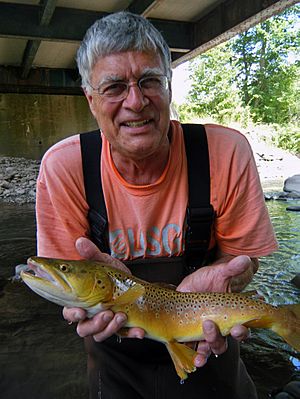Researcher with large brown trout from Esopus Creek