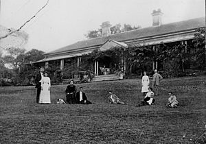 StateLibQld 1 167999 Wilson family members on the lawn at Claremont, Milford Street, Ipswich, 1912