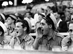 StateLibQld 1 78769 Navy men cheering for their soccer team, Brisbane, March 1945