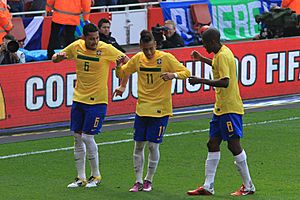 André Santos, Neymar and Ramires celebrate Neymars goal