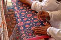 Description- Textile artists demonstrate double ikat weaving at the 2002 Smithsonian Folklife Festival featuring The Silk Road. (2548928970)