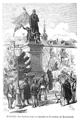 Madrid, la bandera roja es colocada en la estatua de Mendizábal, de Pellicer
