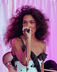 A gold gramophone trophy with a plaque set on a table