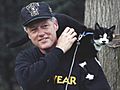 Photograph of President William Jefferson Clinton with Socks the Cat Perched on Clinton's Shoulder- 12-20-1993 (6461509201)