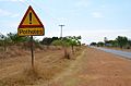 Pothole warning, R512 in North West Province, SA