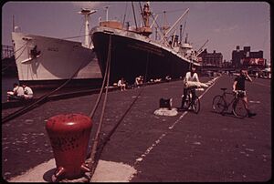 SS JOHN BROWN, THE BLACK HULLED SHIP, SERVES AS THE CITY'S MARITIME HIGH SCHOOL. IT IS BASED AT THE MORTON STREET PIER - NARA - 549931
