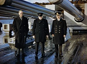 Winston Churchill with the Lord Privy Seal, Sir Stafford Cripps, and the Commander-in-Chief Home Fleet, Admiral Sir John Tovey, on the quarterdeck of HMS KING GEORGE V at Scapa Flow, 11 October 1942. TR210