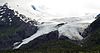 A large glacier sloping down a mountain