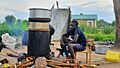 A South Sudanese boy distilling alcohol at home