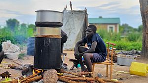 A South Sudanese boy distilling alcohol at home