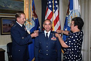 General Bernard P. Randolph is given his fourth set of stars by General Larry D. Welch, CHIEF of STAFF, US Air Force, and Randolph's wife Lucille, during a special ceremony at the P - DPLA - cb1407bca1dc0be978d9093d58bb3945