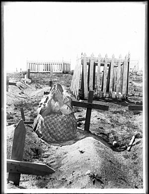 Ramona kneeling at the grave of Alesandro in the cemetery on the Coahuilla Indian Reservation, ca.1905 (CHS-3873)