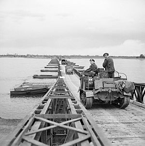 British vehicles crossing 'Lambeth Bridge', one of the pontoon bridges over the Rhine in Germany, 26 March 1945 BU2417