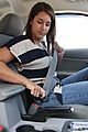 Female driver buckling seatbelt
