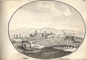 View of the ruins of the Augustinian Abbey at Kells, County Kilkenny, Ireland with the church on the left of the drawing. Beside the church, on its right, is an area enclosed by a wall interspersed with towers. In the foreground is a bridge with a horseman riding over it towards a small mill-house on the left. To the right of the drawing is a Norman motte