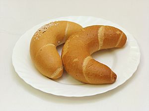 Two crescent-shaped pastries on a white plate
