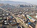 The private sector with yurts against the backdrop of high-rise new buildings in Ulaanbaatar
