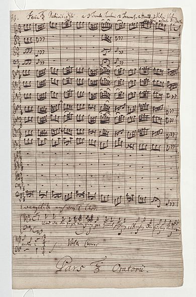 first page of the score in Bach's handwriting, with the instrumental beginning of the first chorus, and below the beginning of the first recitative