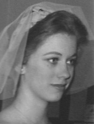 A black and white image of Booth with a veil on her head.