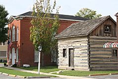 The old Bethalto Village Hall and log cabin