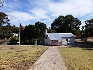 Lomas Cottage and Aboriginal flag