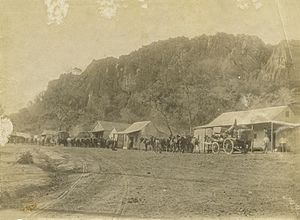StateLibQld 1 113680 Wagon trains in the main street, Mungana, 1898
