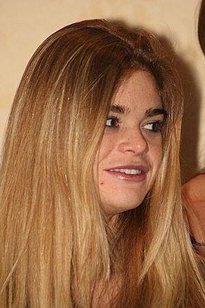 Headshot of actress Ellen Muth, looking to the right of the camera, with her blonde hair filling much of the image