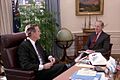 President George H. W. Bush meets with Secretary James Baker in the Oval Office of the White House