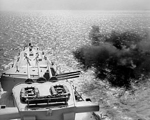 USS Manchester (CL-83) bombarding with 6-inch guns, 1953