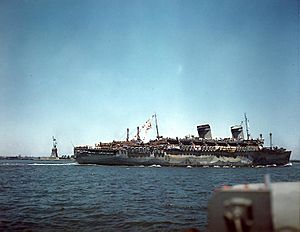 USS West Point (AP-23) steams past the Statue of Liberty, 11 July 1945 (80-G-K-5783-A)
