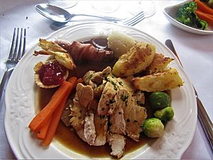 -2019-12-22 Roast turkey served vegtables, pigs in blanket, stuffing, cranberry sauce tartlet, and gravy, Trimingham