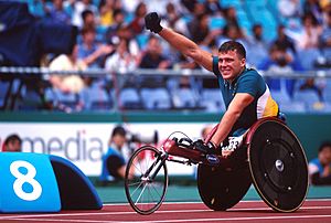 301000 - Athletics wheelchair racing Kurt Fearnely waves - 3b - 2000 Sydney race photo