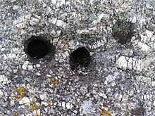 Anchor holes in the granite at Logan Rock Cornwall