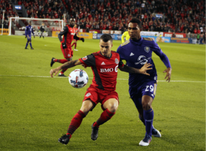 Giovinco holds off Tommy Redding