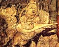 Kinnara with kachchapa veena, part of the Bodhisattva Padmapani, Cave 1, Ajanta, India