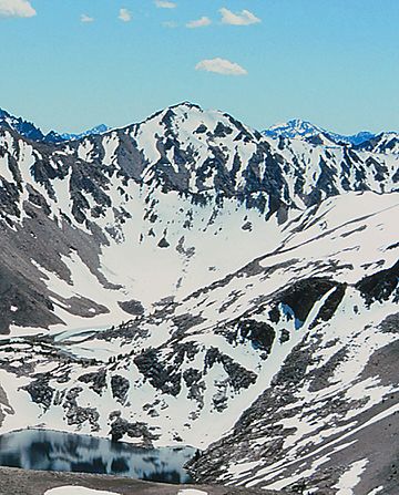 A photo of Lonesome Lake Peak with Sapphire Lake viewed from the south flank of Calkens Peak