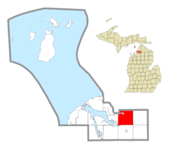 Location within Charlevoix County (red) and the administered community of Walloon Lake (pink)