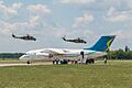 Pair of Ukrainian AF Mil Mi-24P flying over Ukrainian Govt An-148-100V at Chuguyev