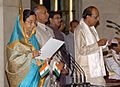 The President, Smt. Pratibha Devisingh Patil administering the oath as Minister of State to Shri Dinesh Trivedi, at a Swearing-in Ceremony, at Rashtrapati Bhavan, in New Delhi on May 28, 2009