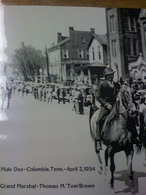 Thomas Marion Brown leading the First Mule Day Parade in 1934