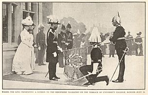 Wales - The King Presenting a Guidon to the Shropshire Yeomanry on the Terrace of University College, Bangor on 14 July 1911