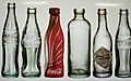 6 Coca-Cola bottles