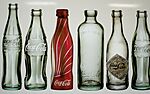 6 Coca-Cola bottles