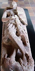 Photograph of the stone effigy of an armed warrior