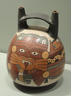 Bridge-spouted Bottle with Anthropomorphic Mythical Being - warrior, 100-300 AD, Nasca culture, south coast Peru, earthenware with colored slips - Gardiner Museum, Toronto - DSC01301