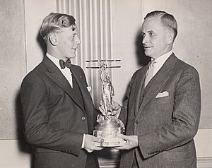 Eddie August Schneider on September 27, 1930 accepting the Great Lakes Trophy in Detroit, Michigan (600 dpi, 100 quality, cropped)