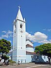 Igreja Matriz de São Sebastião com a torre em destaque, Coronel Fabriciano MG
