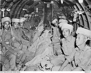 Indian paratroops waiting to jump over Burma 1945